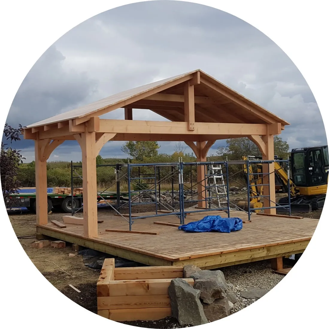 a huge stand alone deck being built with a full roof.