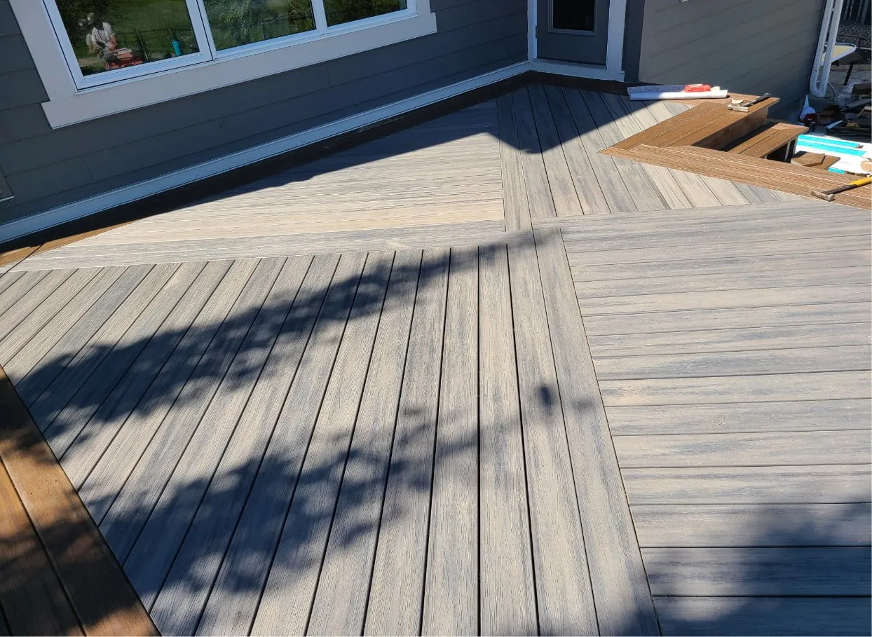 a beautiful PVC deck being built with a very unique pattern