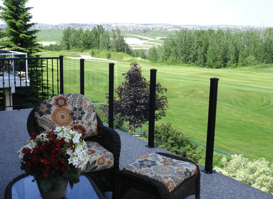 glass railing looking out to a golf course