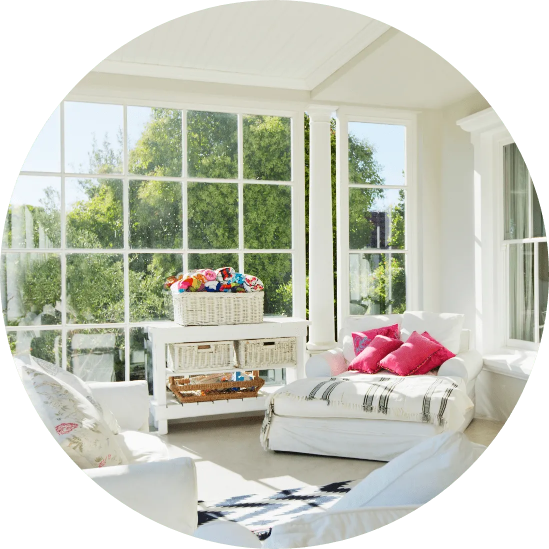 a sunroom that has comfy couches