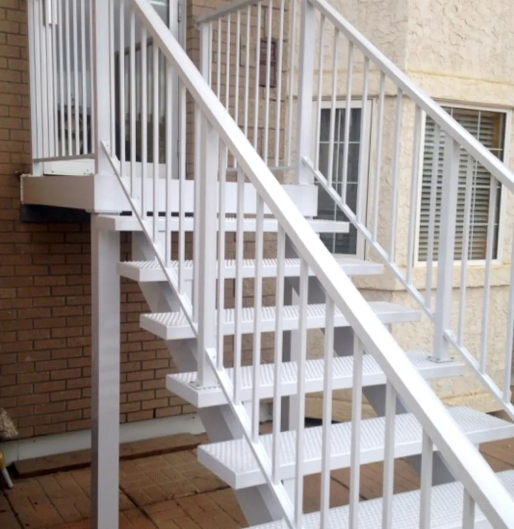 white stairs leading down from a small white deck