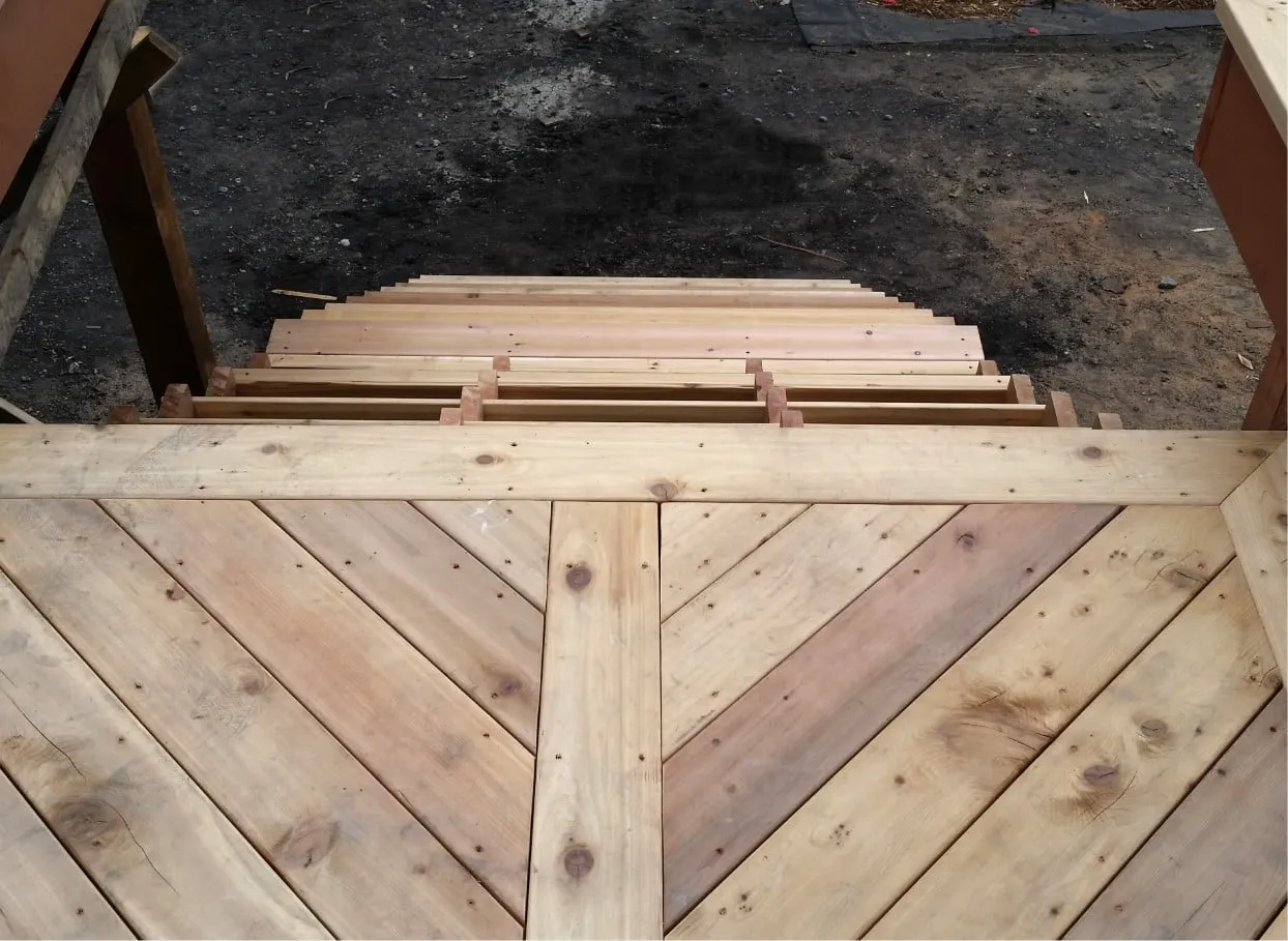 wood stairs being installed on a deck